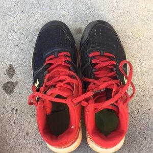 Red and Black Under Armour cleats